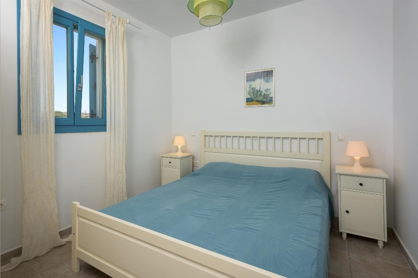 Second double bedroom at Villa Ilios with a window to the sea